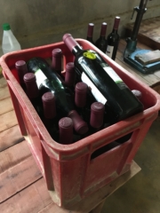 A crate full of labeled bottles