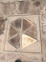 The symbol of the six communities. Three for agriculture, three for sheep.